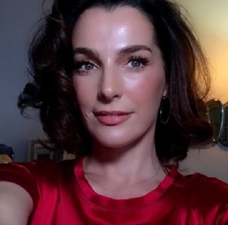 Ayelet Zurer is posing for the photo.